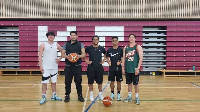 group photo of students in basketball gear